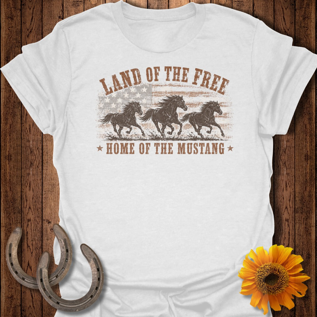 White t-shirt with "Land of the Free, Home of the Mustang" text and three horses.