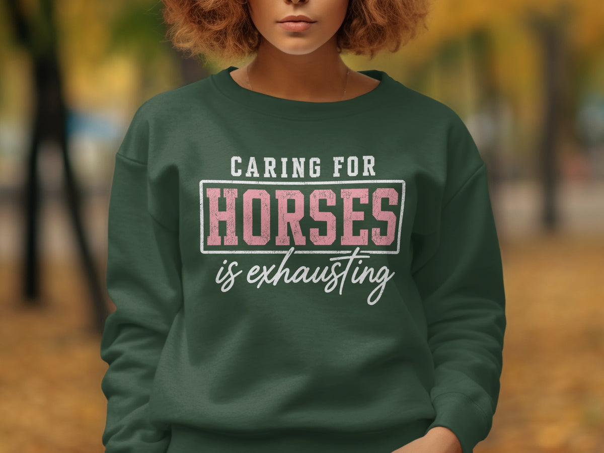 Dark green sweatshirt with text "Caring For Horses is Exhausting".