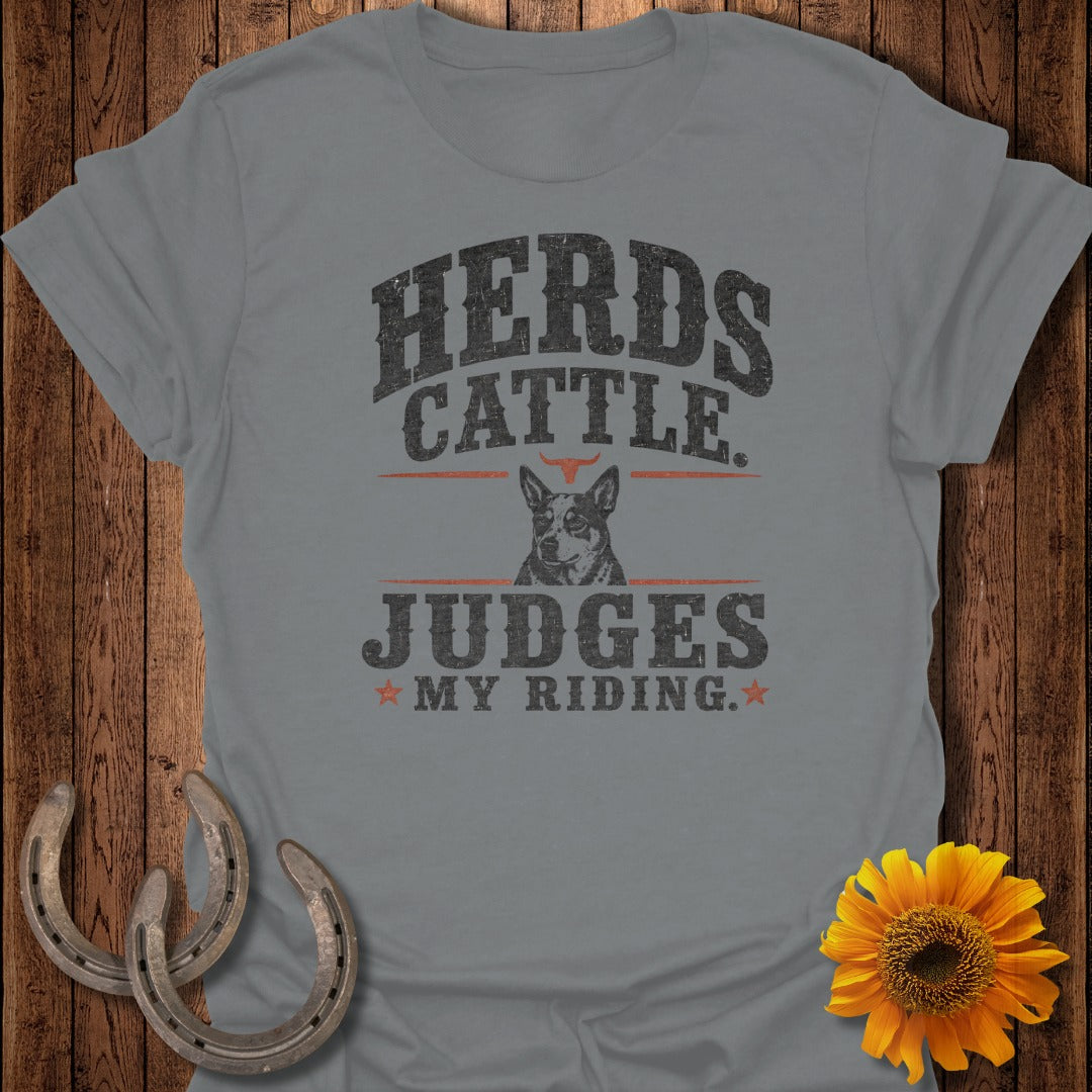 Gray t-shirt with distressed text "Herds Cattle Judges My Riding" and a dog graphic.