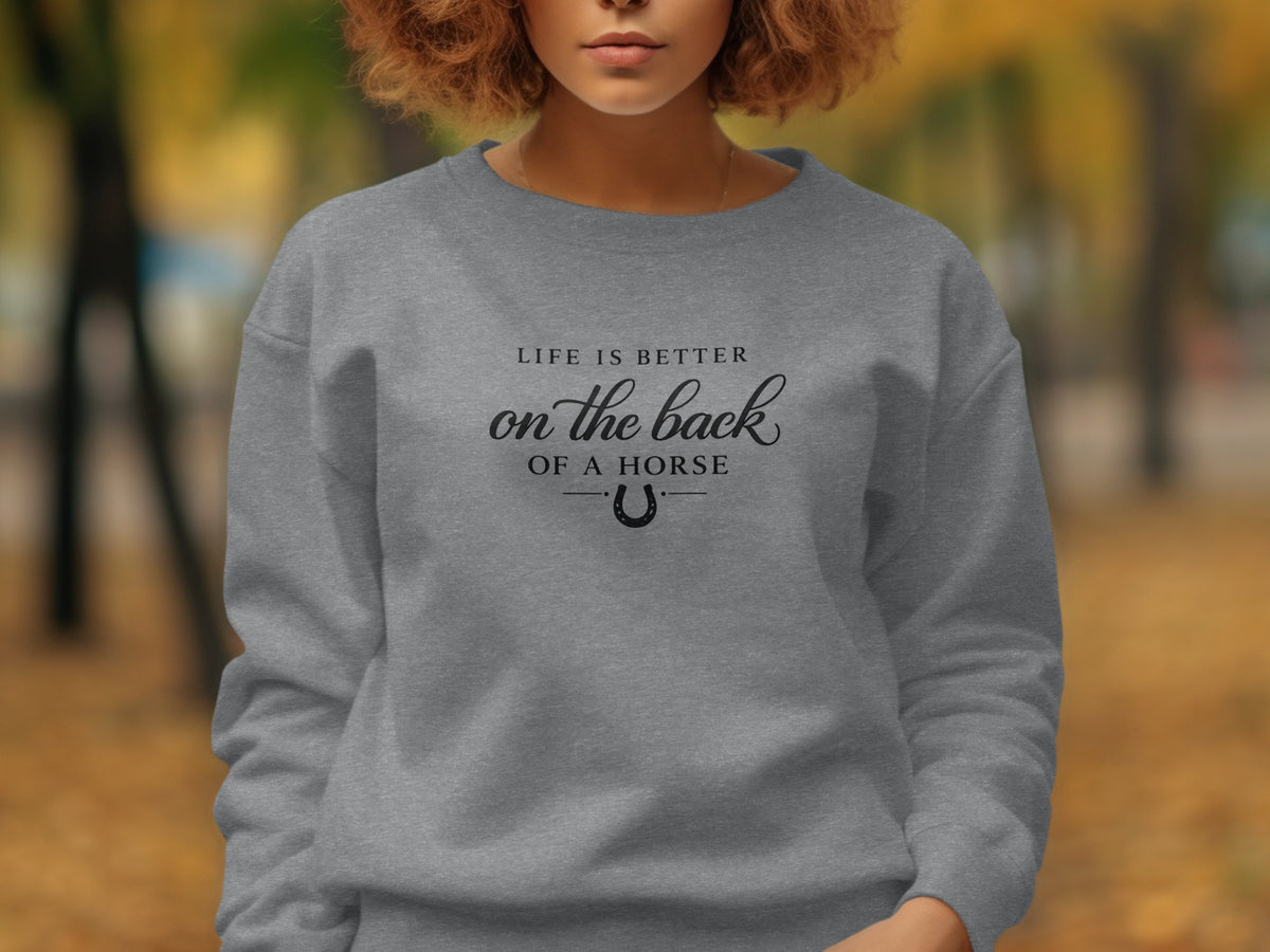 Grey sweatshirt with text "Life is better on the back of a horse" and horseshoe.