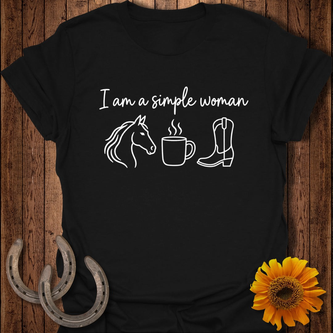 Black t-shirt featuring the white text "I am a simple woman" alongside outline icons of a horse, a steaming mug, and a cowboy boot.