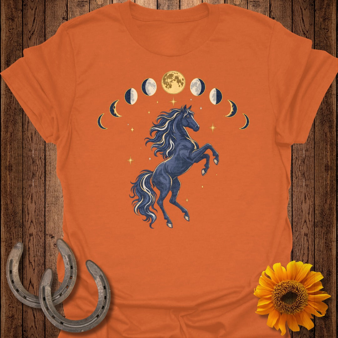 Dark horse rearing under moon phases on an orange t-shirt with sunflowers.