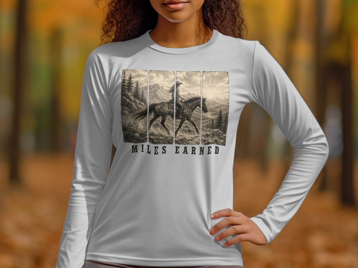 Long sleeve shirt with vintage horse and rider illustration and "Miles Earned" text.