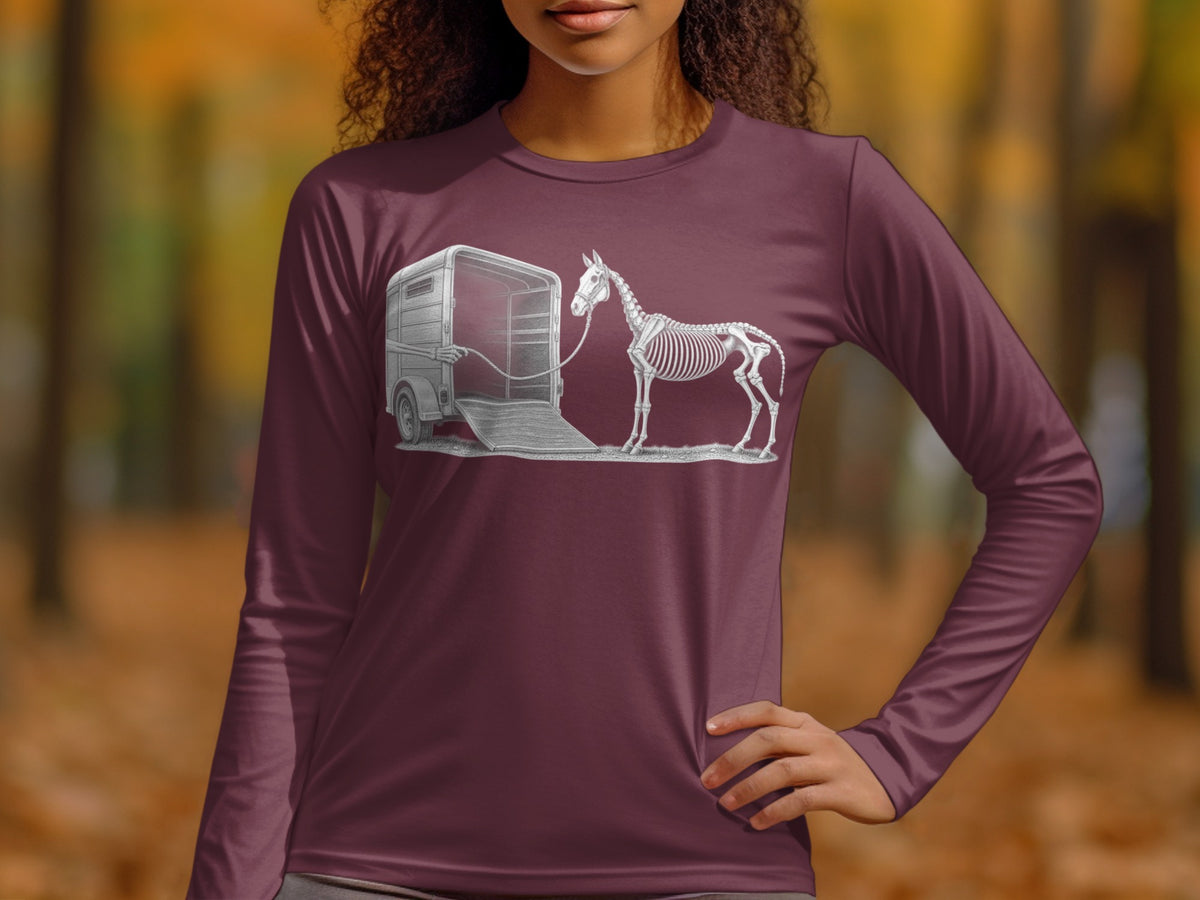 Skeleton horse tied to an open horse trailer by a rope.