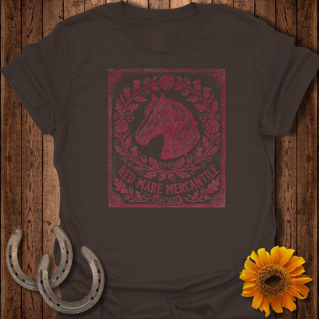 Dark brown t-shirt with distressed red mare horse and floral wreath logo.