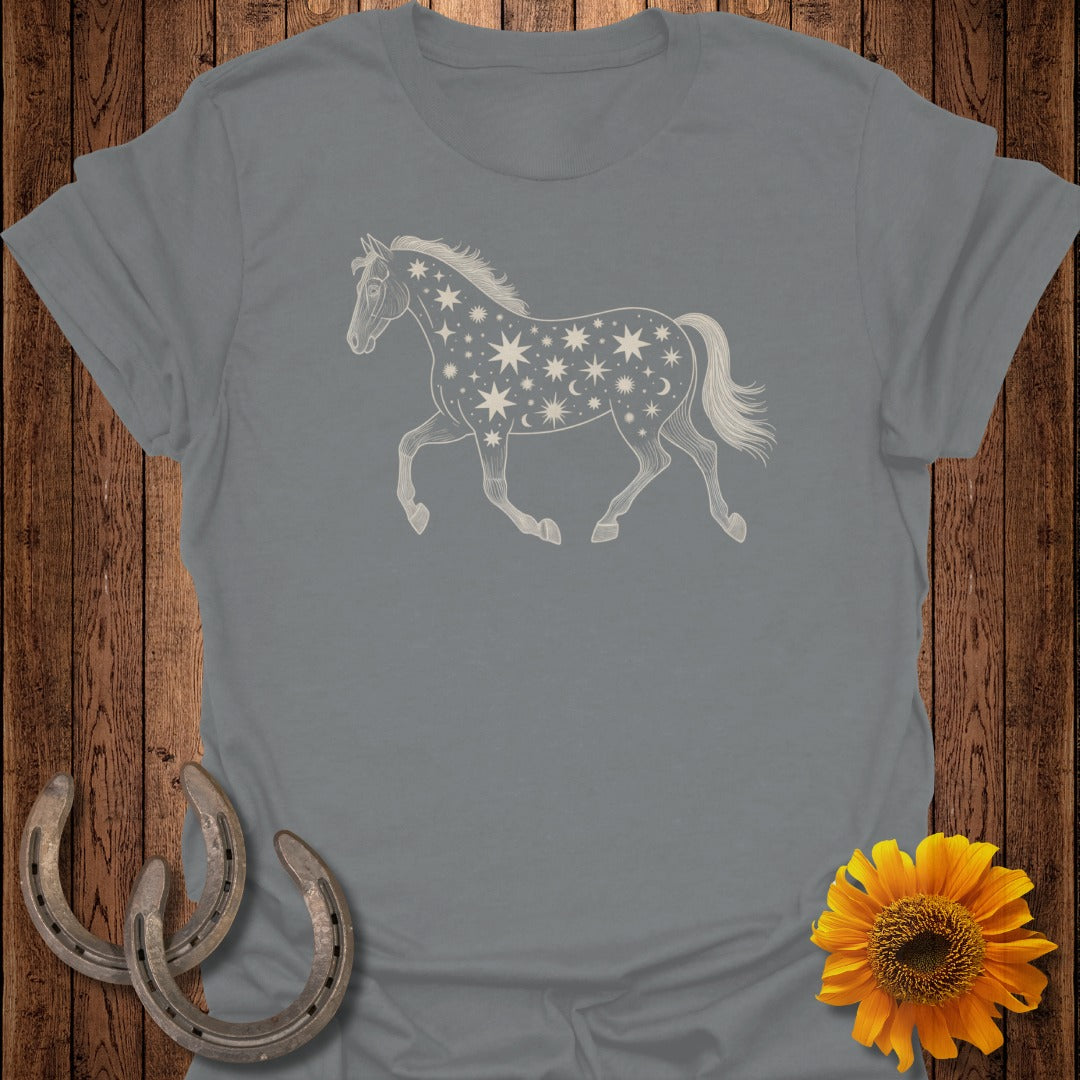 Grey t-shirt with a running horse graphic filled with stars and moons.