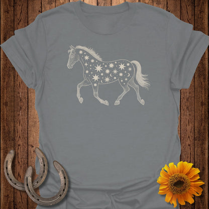 Grey t-shirt with a running horse graphic filled with stars and moons.