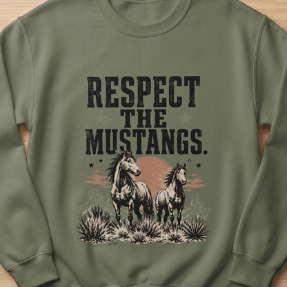 Two horses stand in a desert landscape with the text "RESPECT THE MUSTANGS."