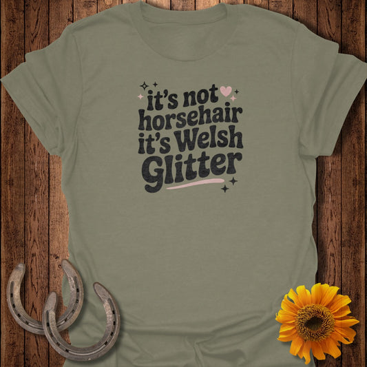 Olive green t-shirt with "it's not horsehair it's Welsh Glitter" text.