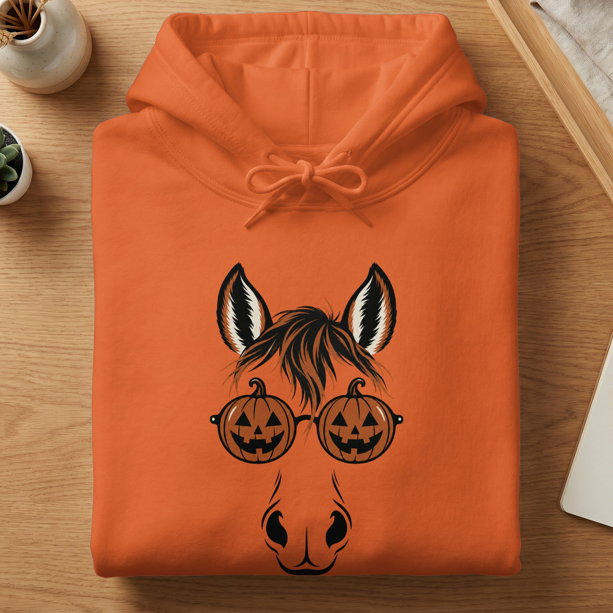 Orange hoodie with horse ears, pumpkin glasses, and a horse nose graphic.